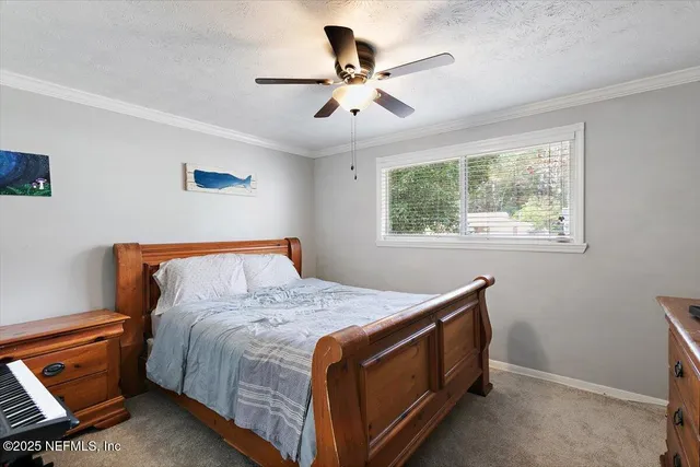 a bed room with a bed and a window