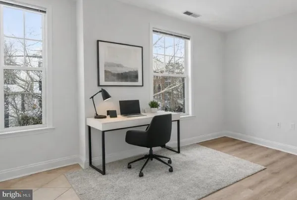 a workspace with furniture and a window