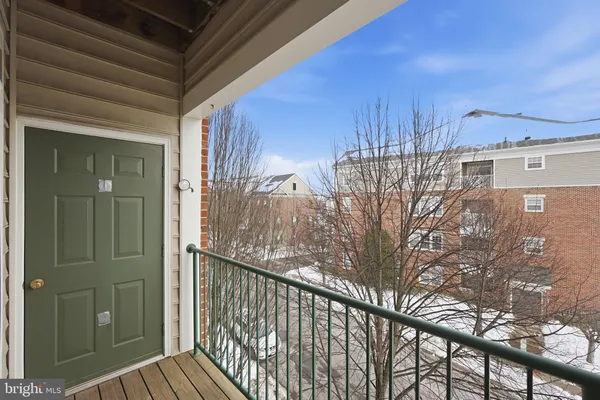a view of a balcony with a potted plant