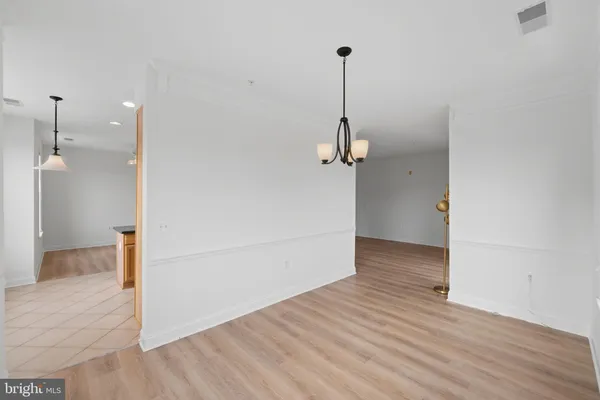 a view of a room with a wooden floor