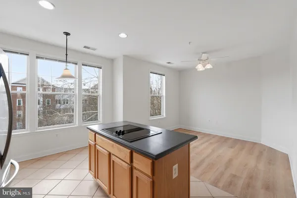 a kitchen that has a sink and a stove