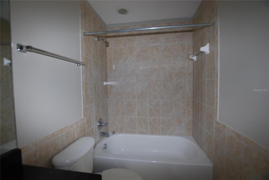 312 East Hibiscus Drive Lakeland, FL 33803 - Photo 17 of 25 a bathroom with a bathtub and a shower