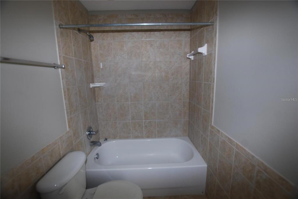 312 East Hibiscus Drive Lakeland, FL 33803 - Photo 18 of 25 a bathroom with a tub and a shower