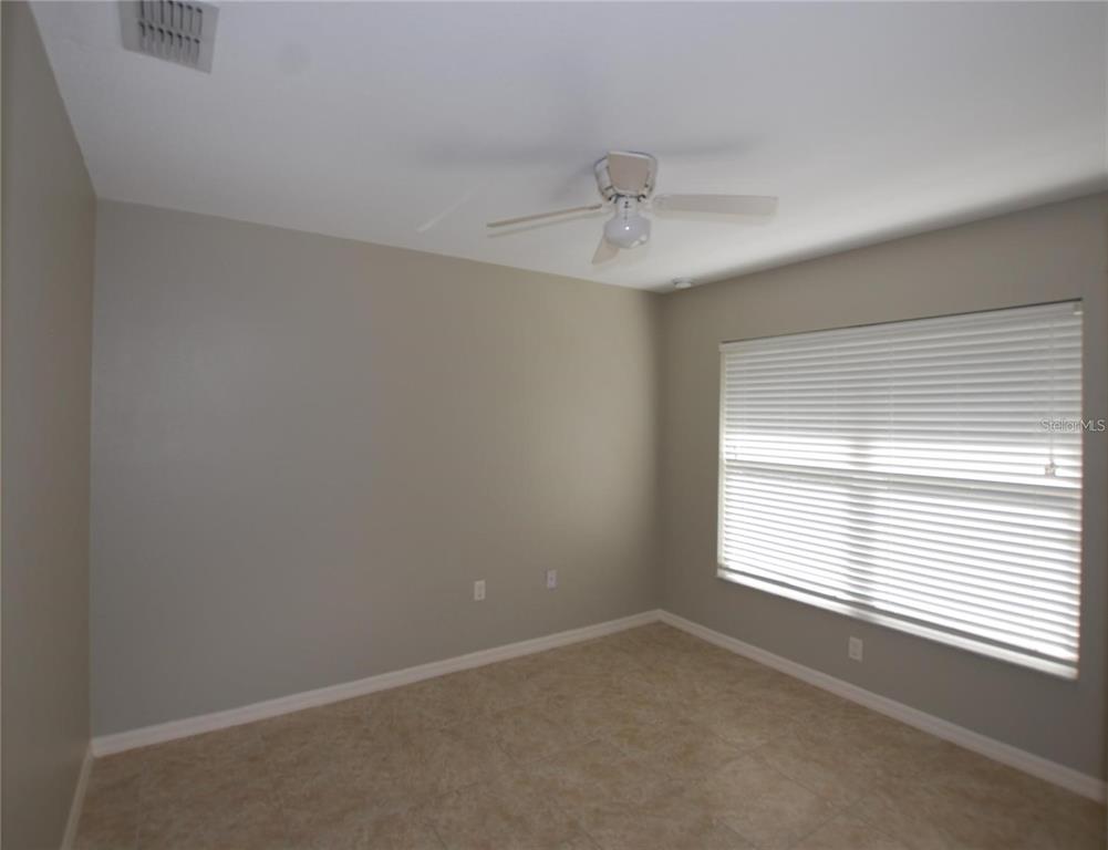 312 East Hibiscus Drive Lakeland, FL 33803 - Photo 9 of 25 a view of an empty room with a window