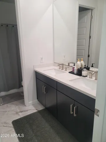 a balcony with table and chairs