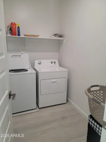 a balcony with a table and chairs