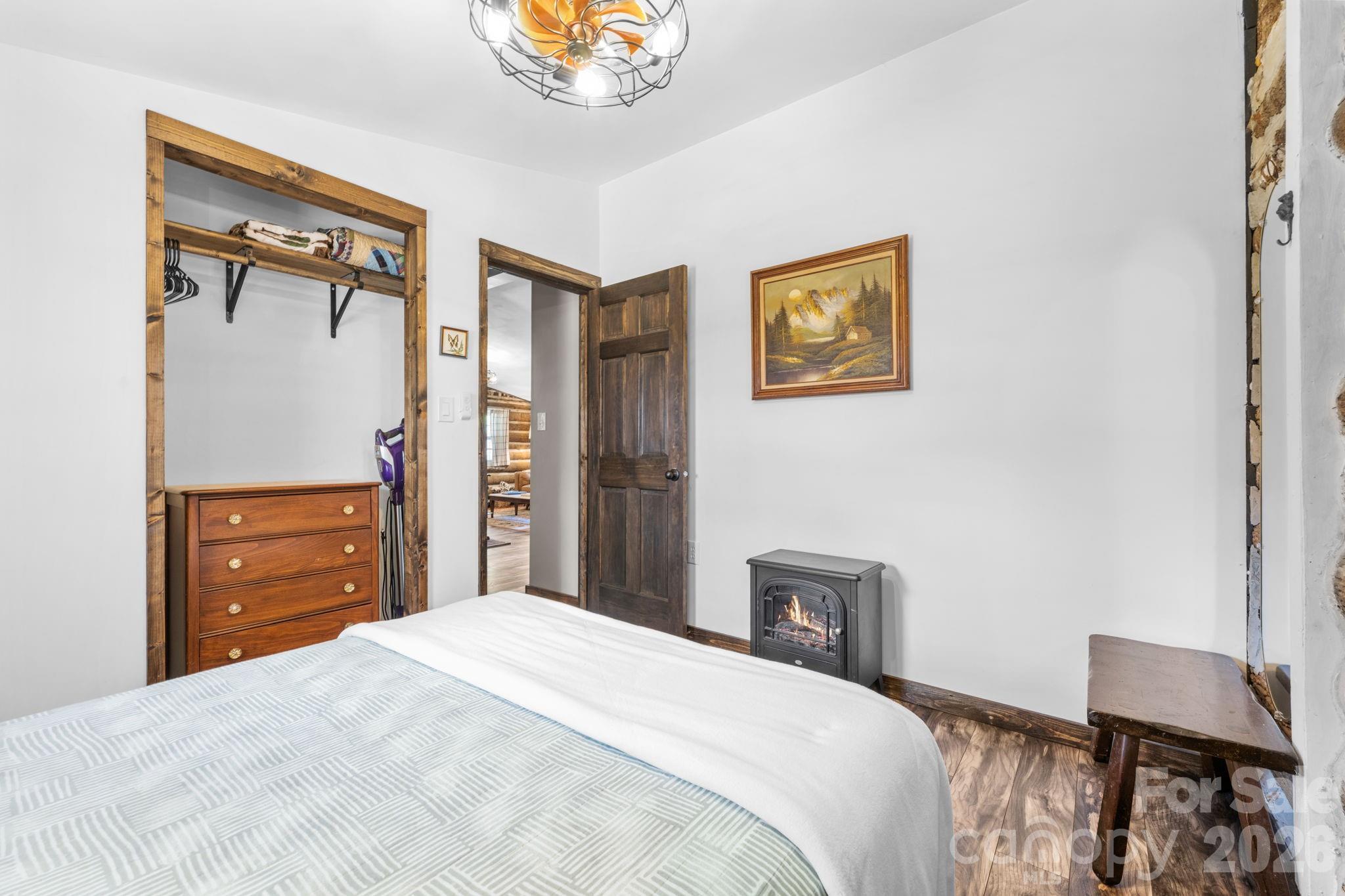 245 Davenport Road Spruce Pine, NC 28777 - Photo 11 of 25 a bedroom with a bed and a dresser