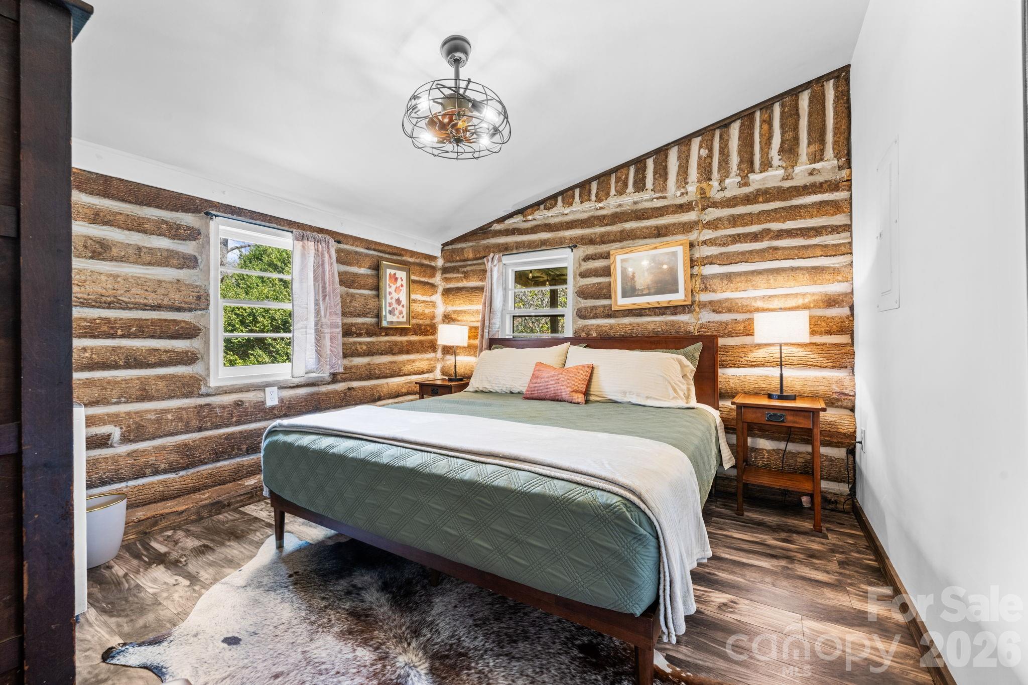245 Davenport Road Spruce Pine, NC 28777 - Photo 13 of 25 a bedroom with a bed and a window