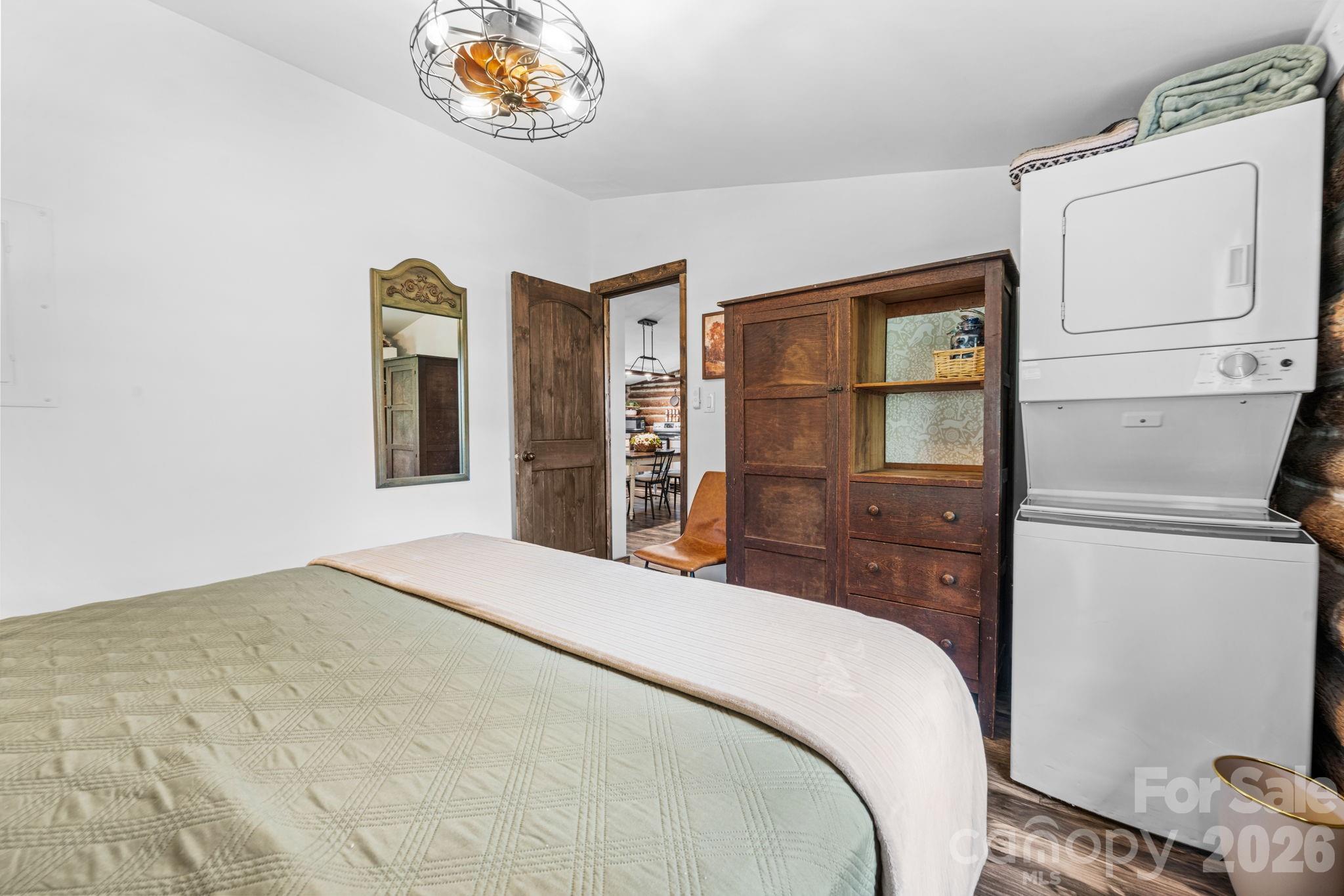 245 Davenport Road Spruce Pine, NC 28777 - Photo 14 of 25 a bedroom with a bed and a window