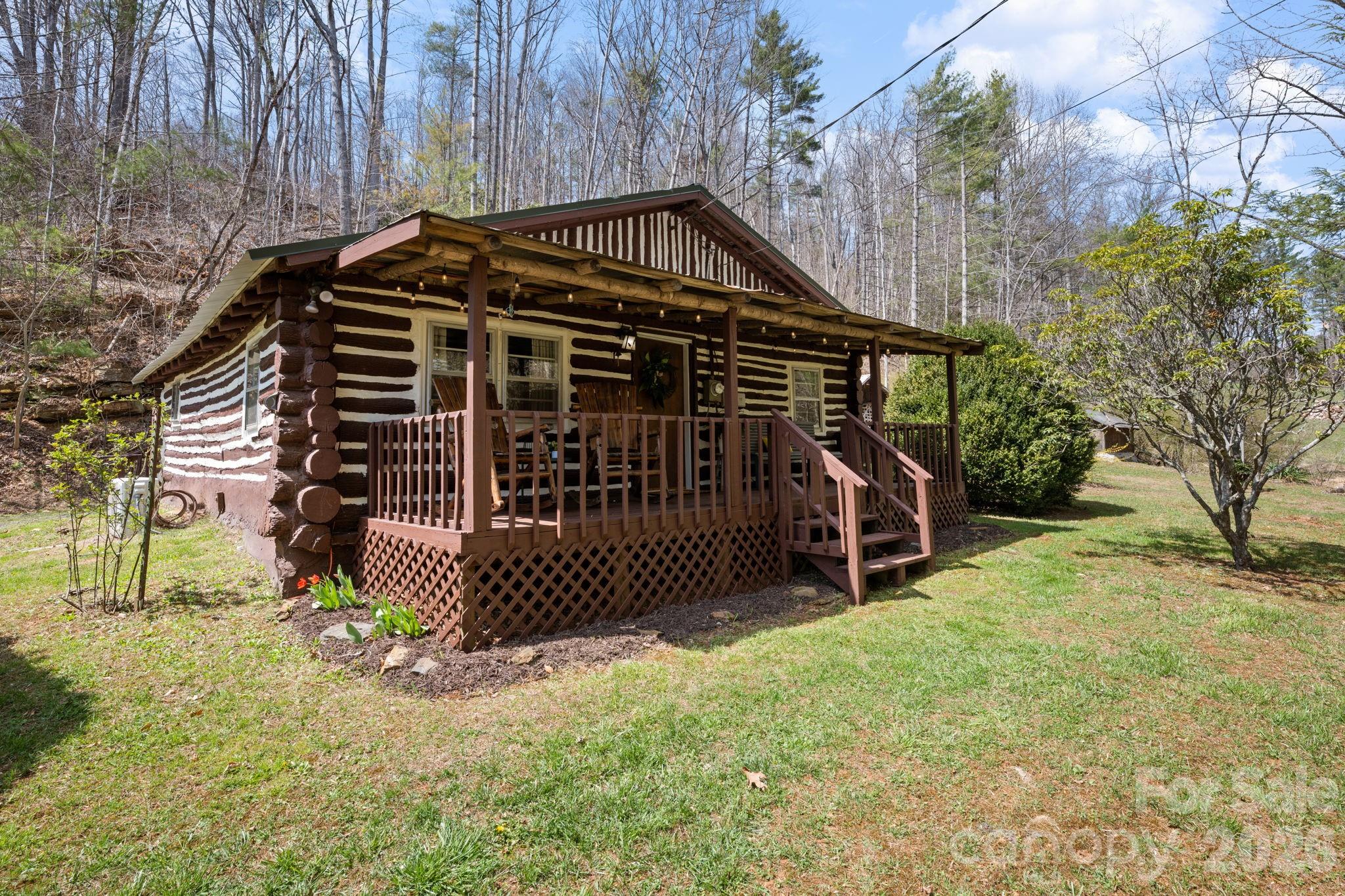 245 Davenport Road Spruce Pine, NC 28777 - Photo 17 of 25 a view of a house with a yard