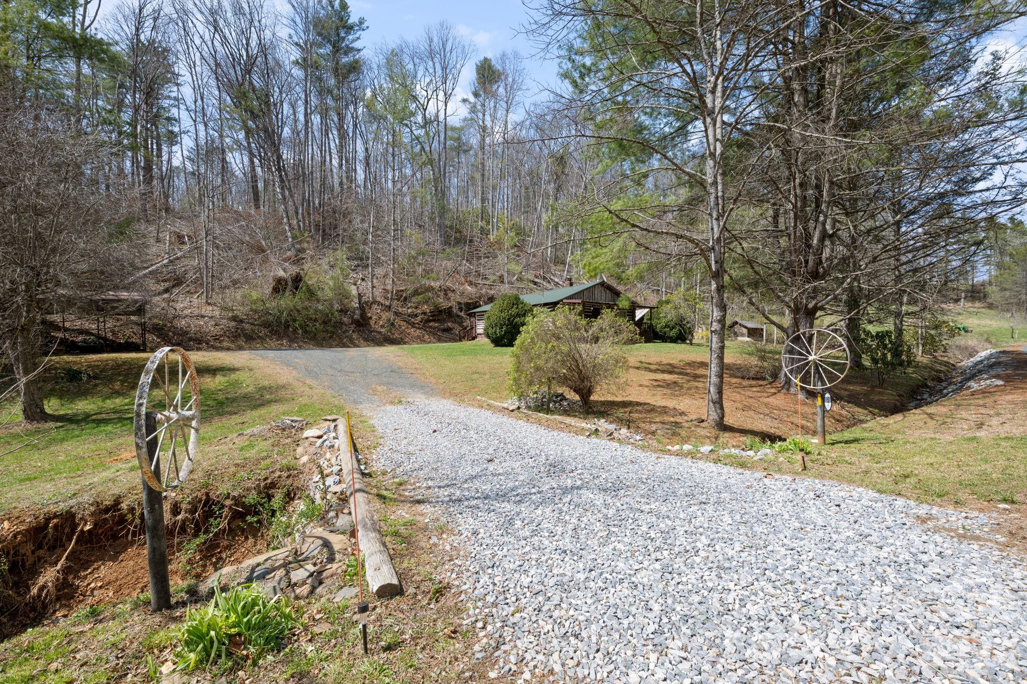 245 Davenport Road Spruce Pine, NC 28777 - Photo 19 of 25 a view of a backyard with trees