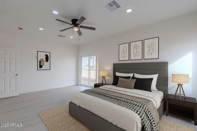 a bedroom with a large bed and a window