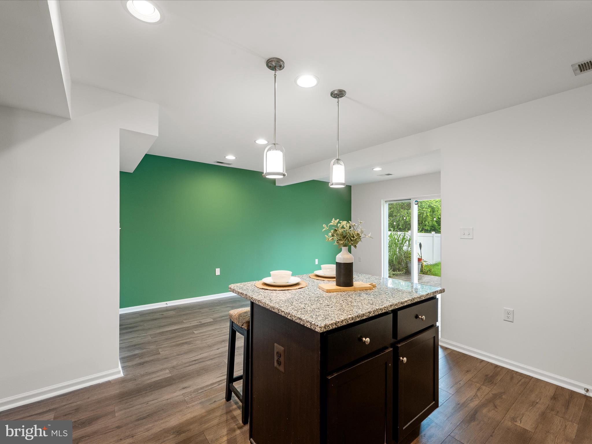 576 Thumper Drive Ranson, WV 25438 - Photo 13 of 37 a kitchen with a sink and wooden floor