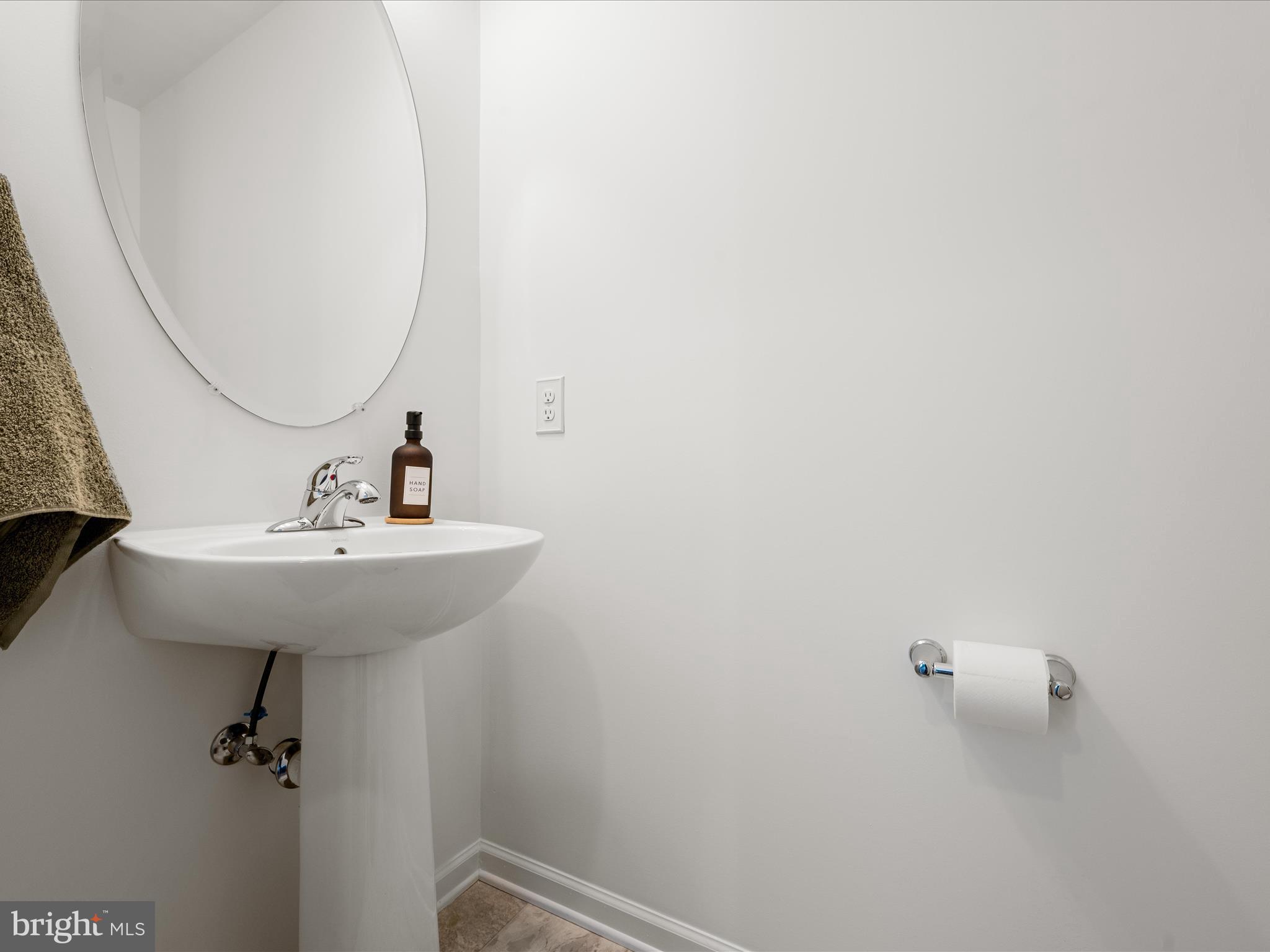576 Thumper Drive Ranson, WV 25438 - Photo 20 of 37 a bathroom with a sink and mirror