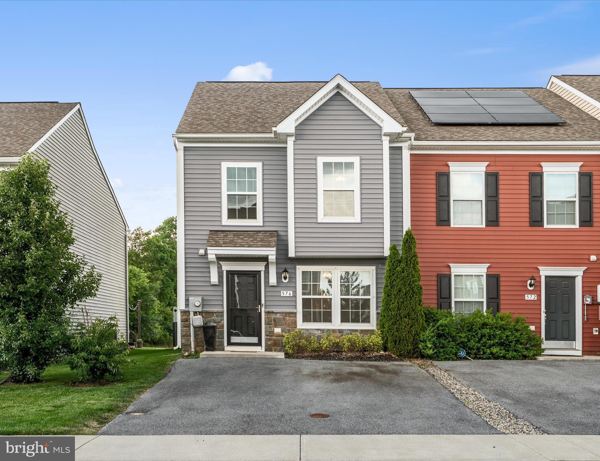 576 Thumper Drive Ranson, WV 25438 - Photo 2 of 37 front view of a brick house with a yard