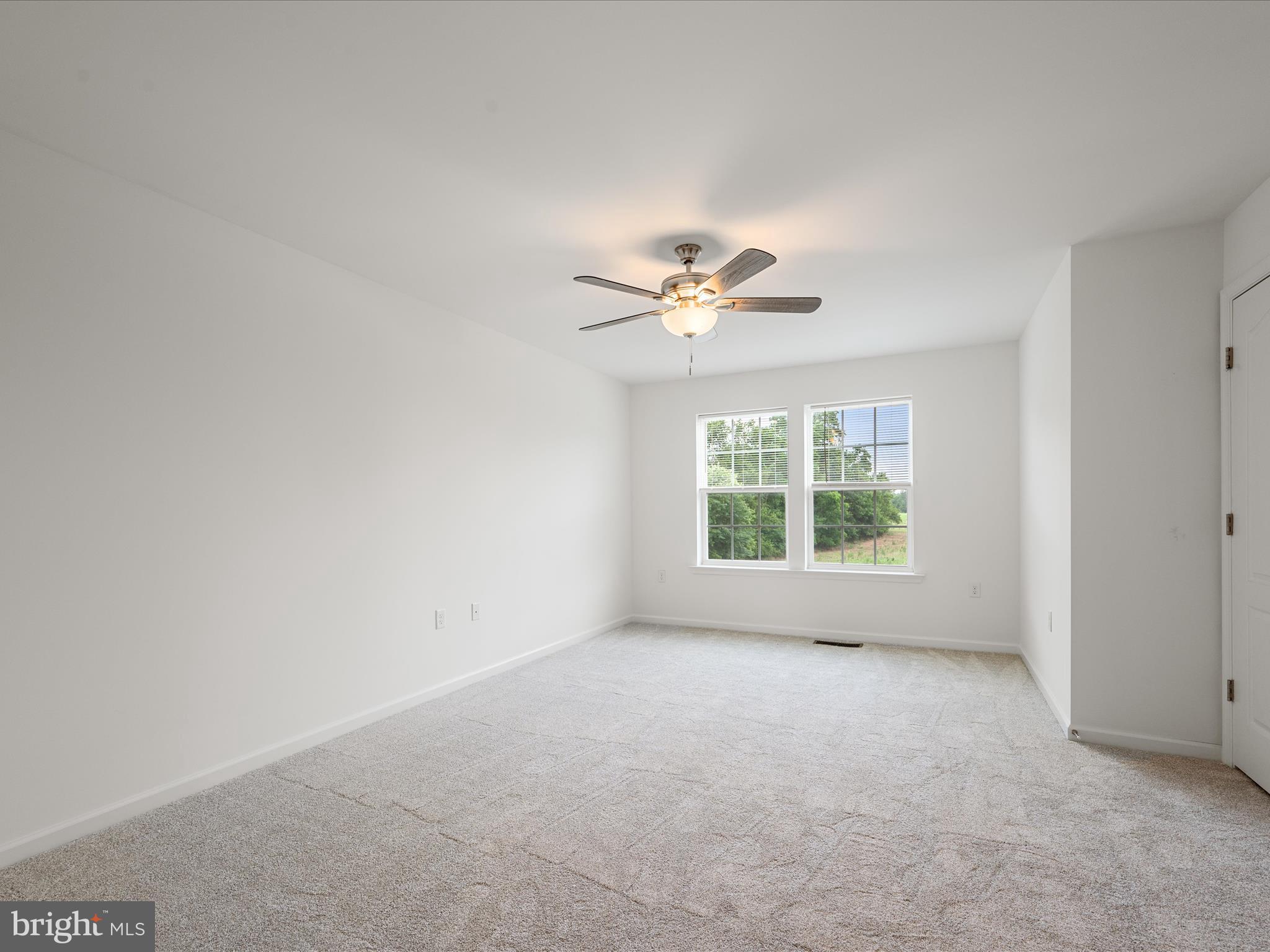 576 Thumper Drive Ranson, WV 25438 - Photo 22 of 37 a view of an empty room with a window