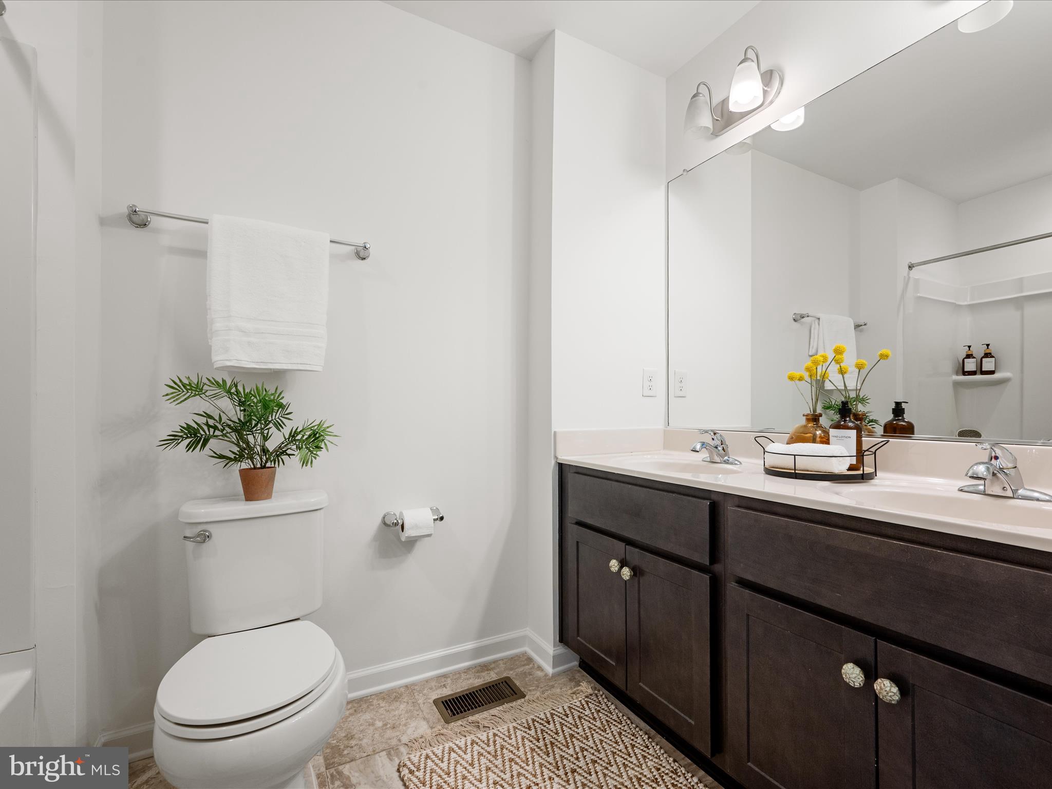 576 Thumper Drive Ranson, WV 25438 - Photo 24 of 37 a bathroom with a toilet a sink and mirror