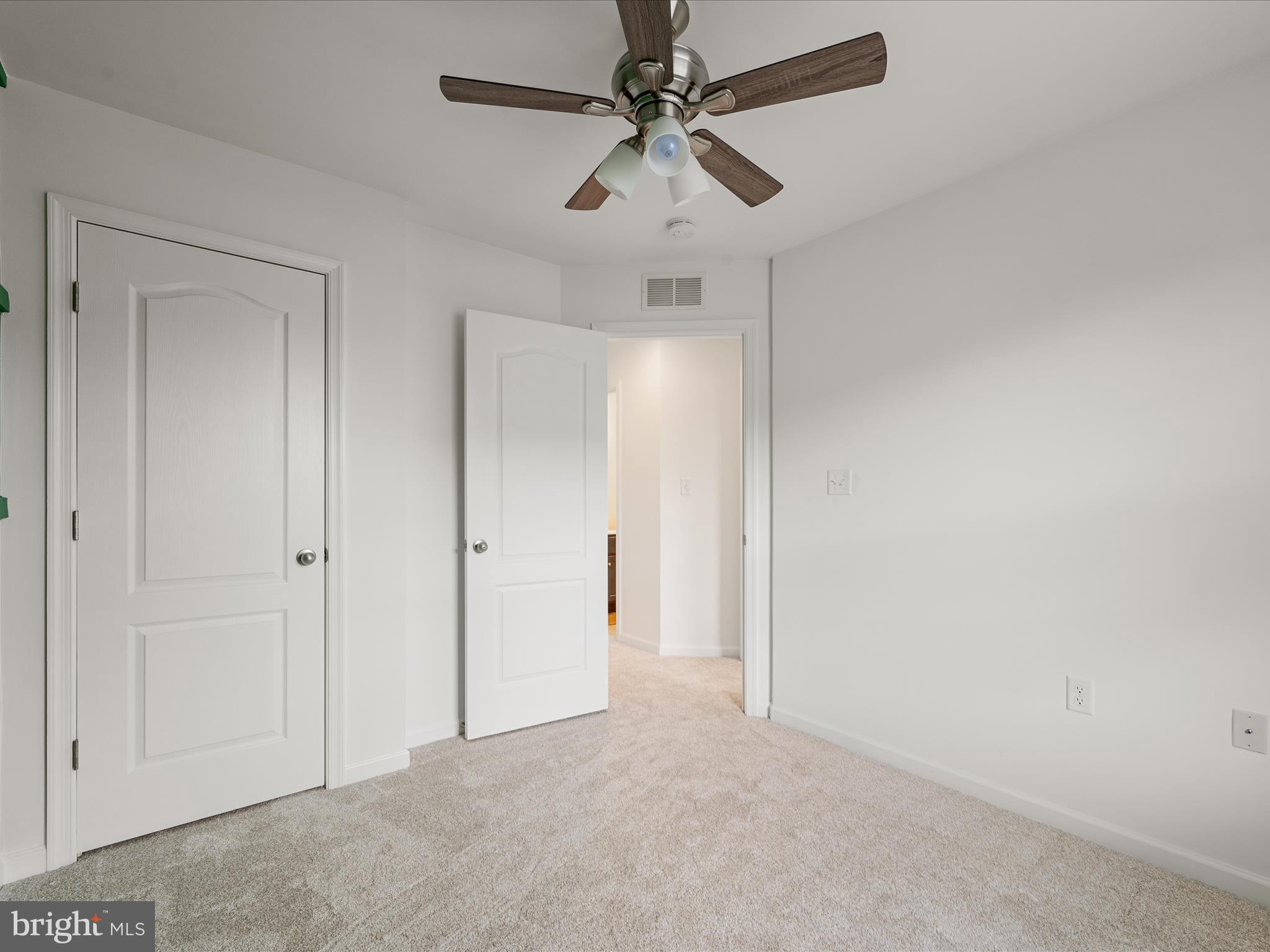 576 Thumper Drive Ranson, WV 25438 - Photo 27 of 37 an empty room with chandelier fan
