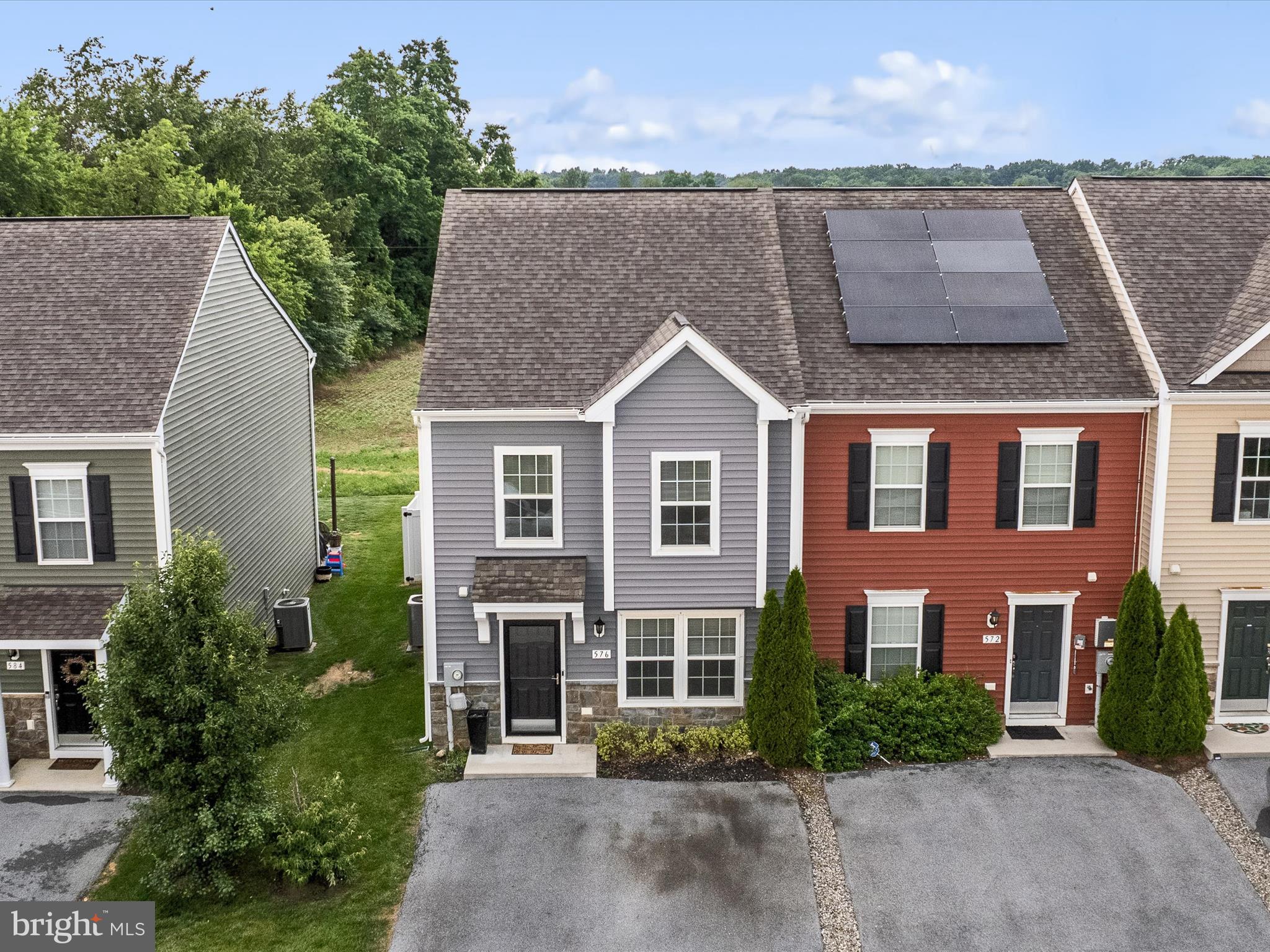 576 Thumper Drive Ranson, WV 25438 - Photo 34 of 37 a front view of a house with a yard and garage