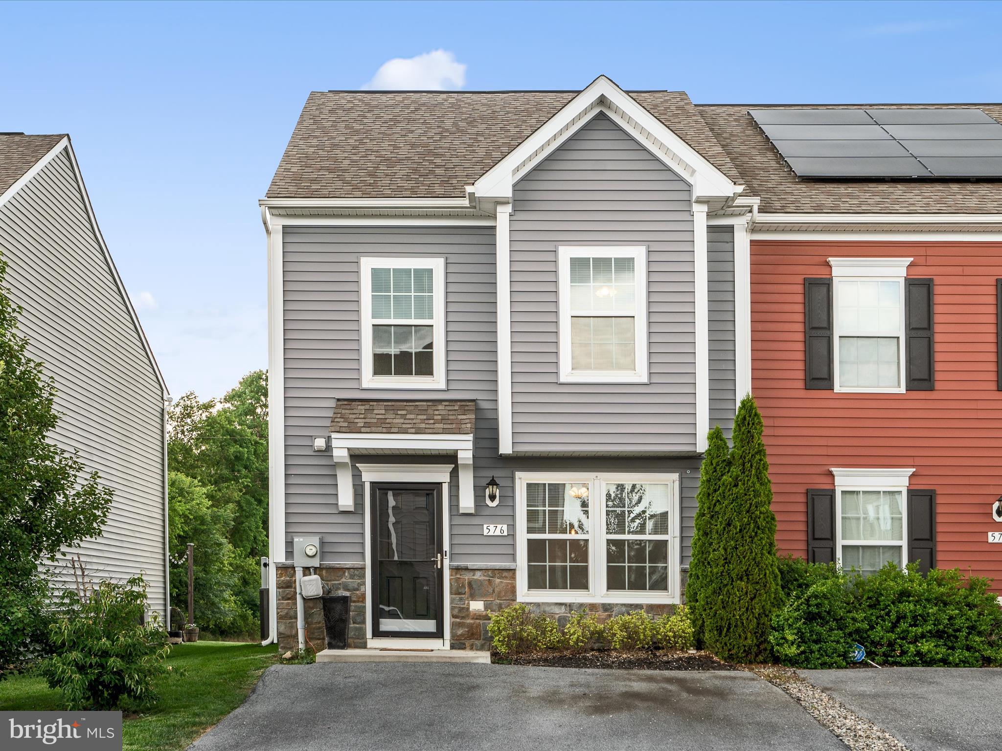 576 Thumper Drive Ranson, WV 25438 - Photo 4 of 37 a view of a brick house with large windows