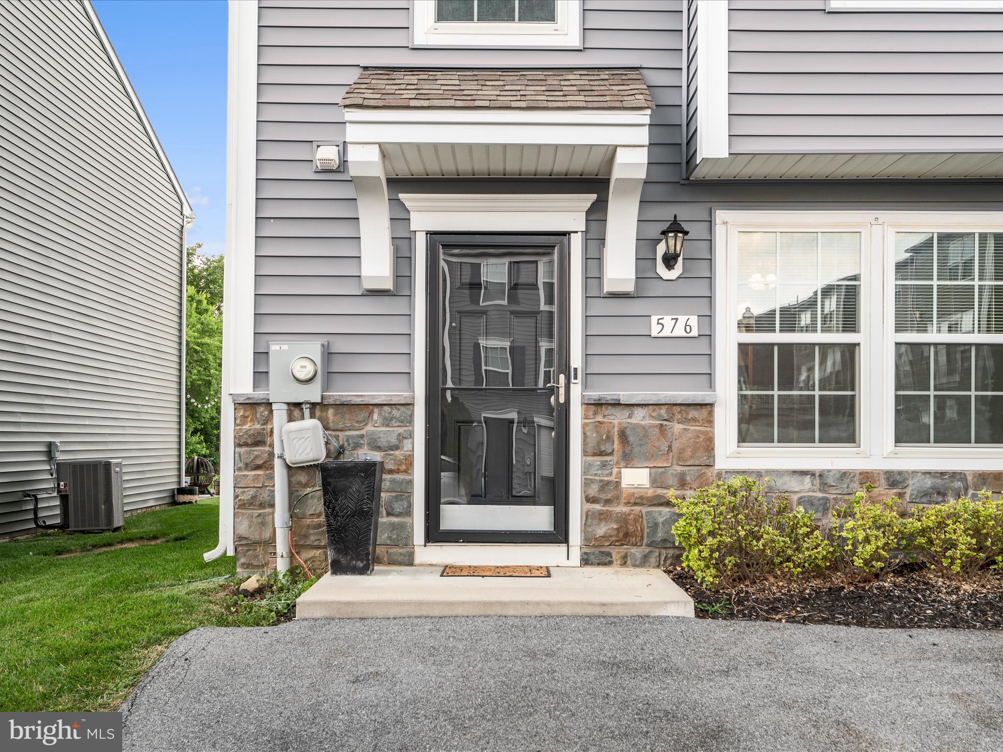 576 Thumper Drive Ranson, WV 25438 - Photo 5 of 37 a front view of a house with a garden