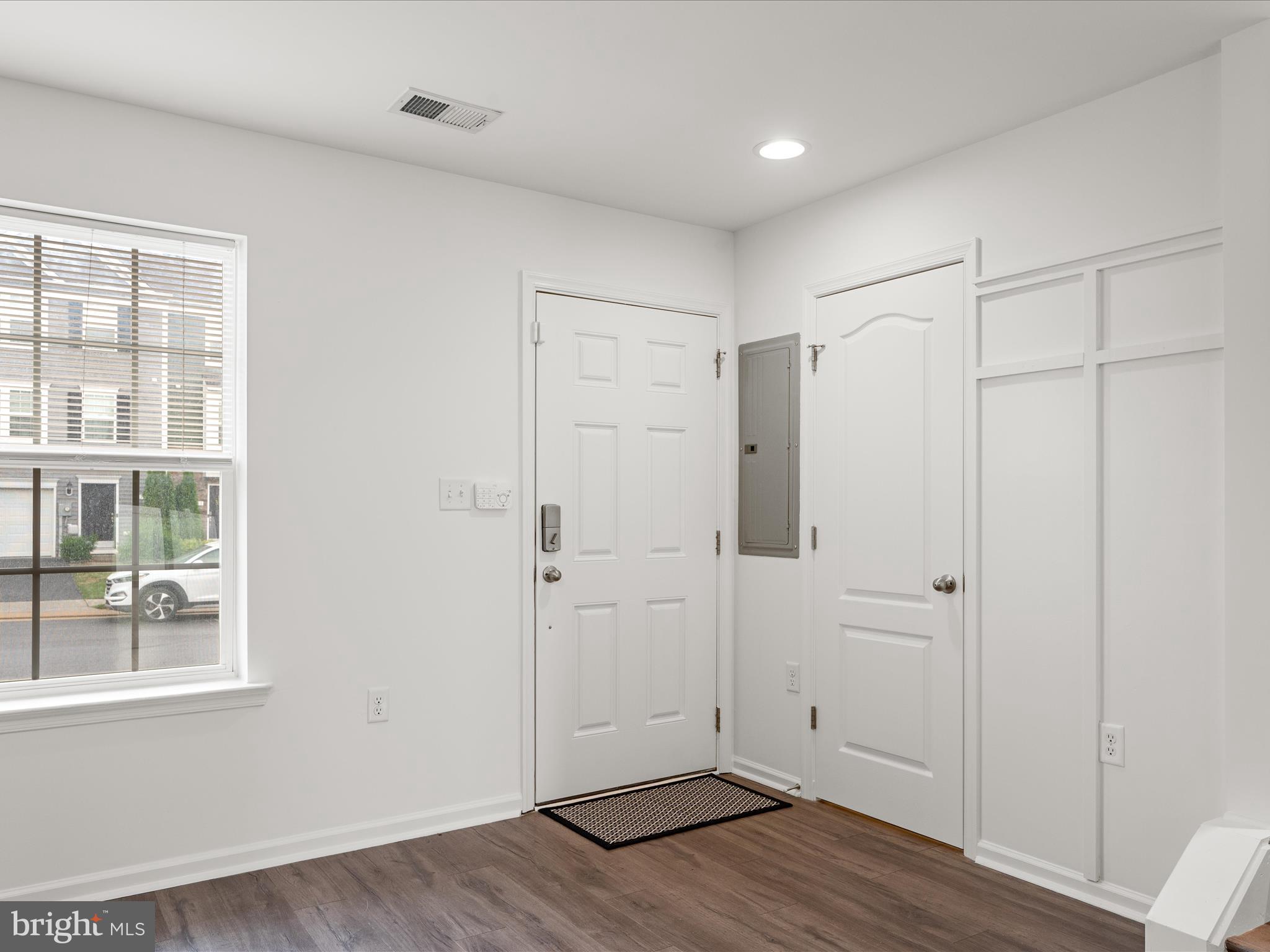576 Thumper Drive Ranson, WV 25438 - Photo 6 of 37 a view of an empty room with wooden floor and a window
