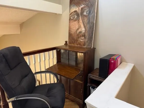 a balcony with table and chairs