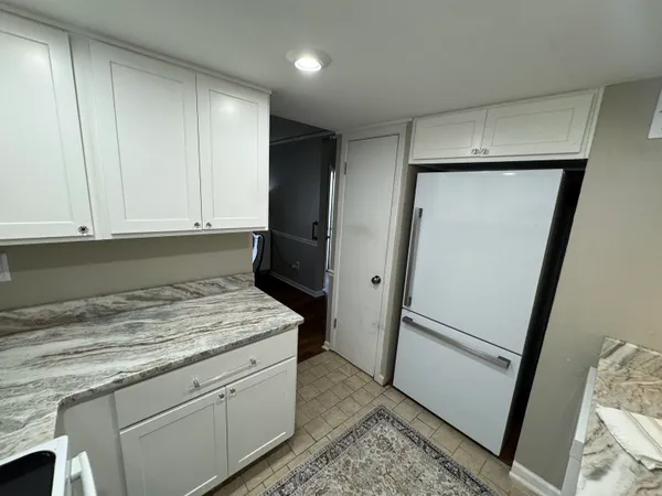 a kitchen with a sink and a refrigerator