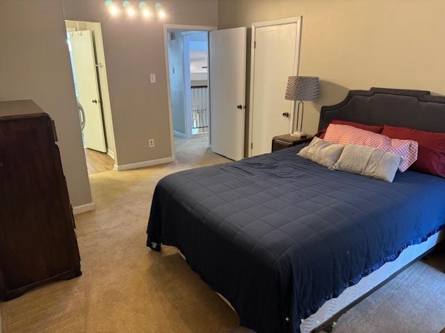 1906 Allenby Road Germantown, TN 38139 - Photo 29 of 31 a bedroom with a bed and a mirror