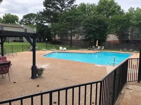 a view of a swimming pool with a patio