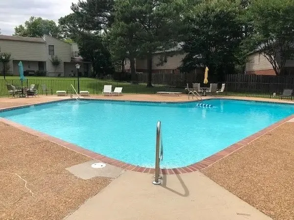 a view of a swimming pool with a patio
