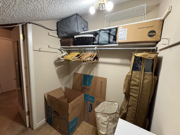 a kitchen with stainless steel appliances granite countertop a refrigerator and a stove