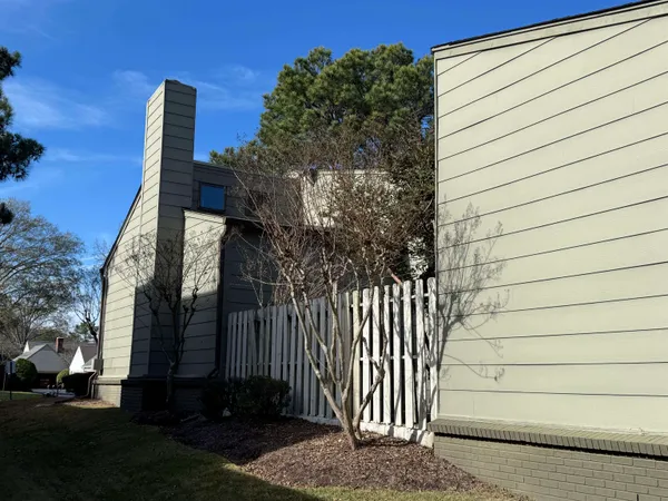 a view of a house with a door and tree