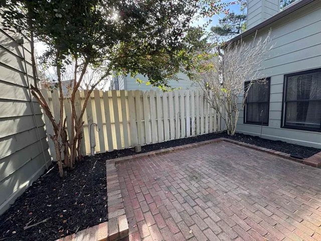 a view of a backyard with pathway