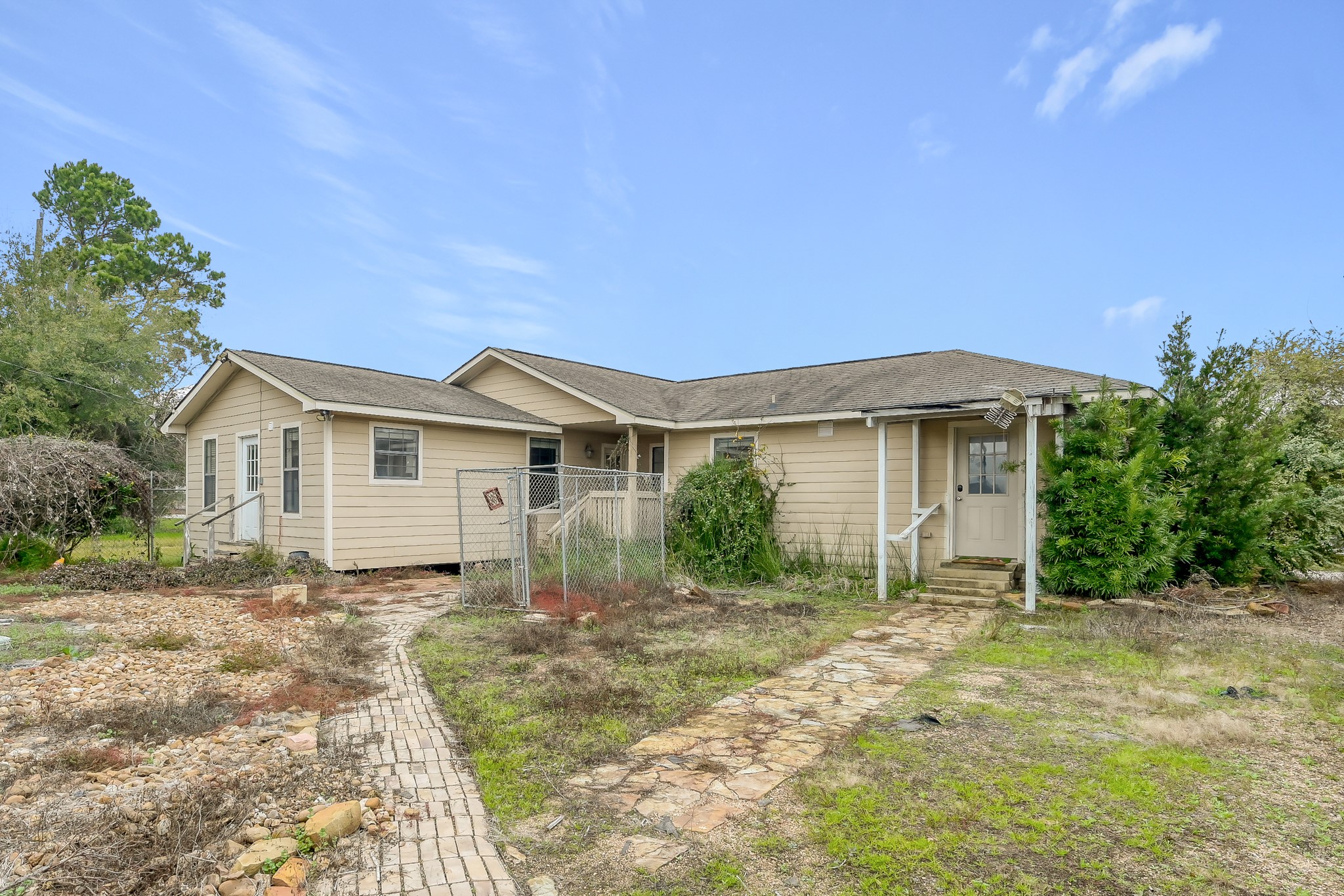 7644 Spring Cypress Road Spring, TX 77379 - Photo 11 of 28 a front view of a house with a yard