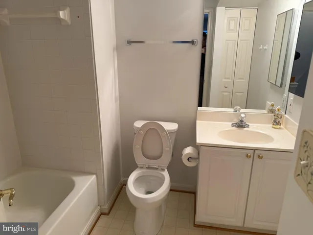 a bathroom with a sink a toilet and bathtub