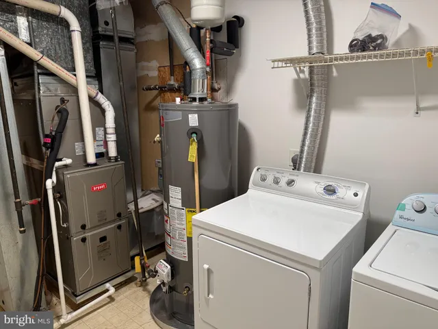 a view of storage and utility room with washer and dryer