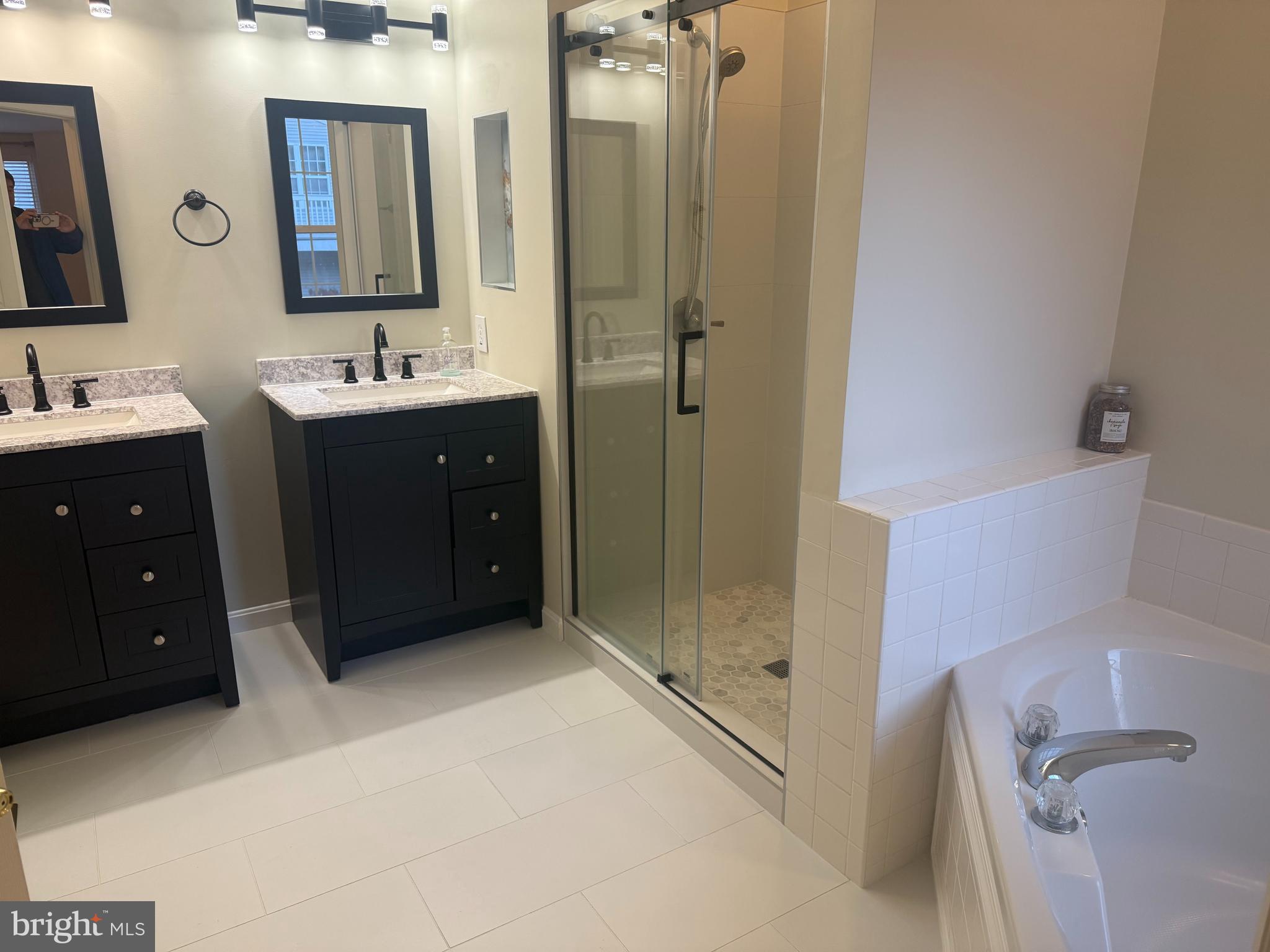 13 Crusader Court Germantown, MD 20874 - Photo 17 of 20 a bathroom with a double vanity sink mirror and shower