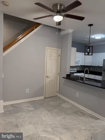 a view of a livingroom with a ceiling fan