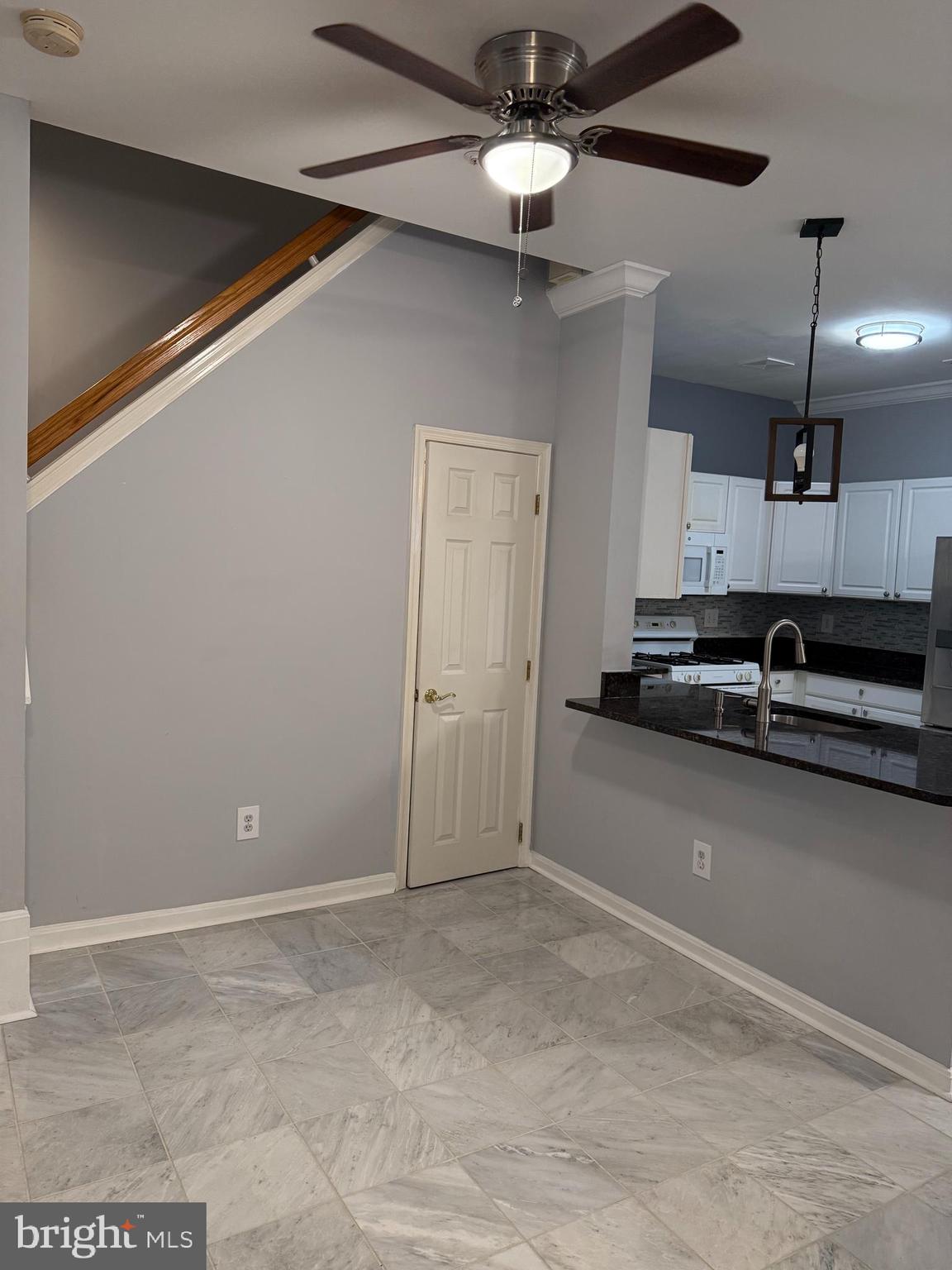 13 Crusader Court Germantown, MD 20874 - Photo 7 of 20 a view of a livingroom with a ceiling fan