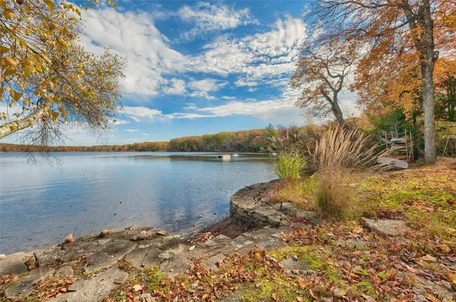 a view of a lake with a yard