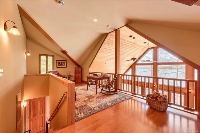 a view of an entryway with wooden floor