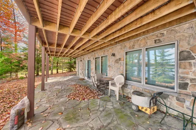 a living room with furniture and a outdoor space