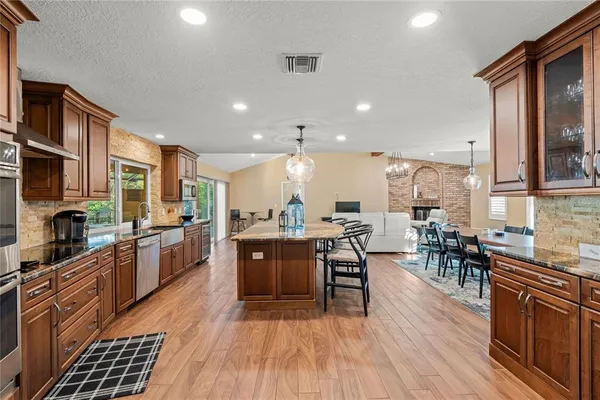 a large kitchen with kitchen island a large island in the center