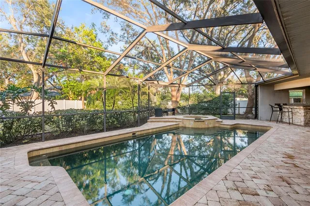 a view of a swimming pool with a patio