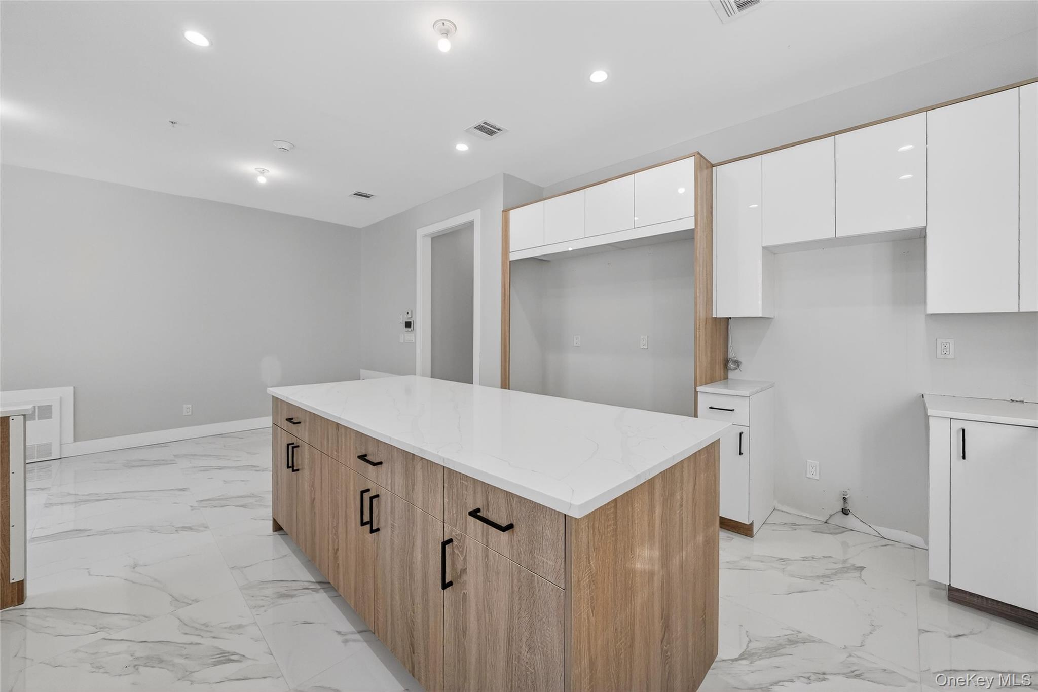 35 South Cole Avenue, Unit 202 Spring Valley, NY 10977 - Photo 12 of 50 a kitchen with a sink and a refrigerator