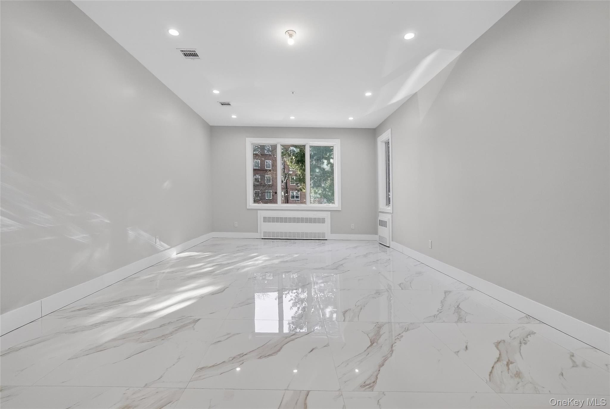 35 South Cole Avenue, Unit 202 Spring Valley, NY 10977 - Photo 18 of 50 a view of an empty room with a window