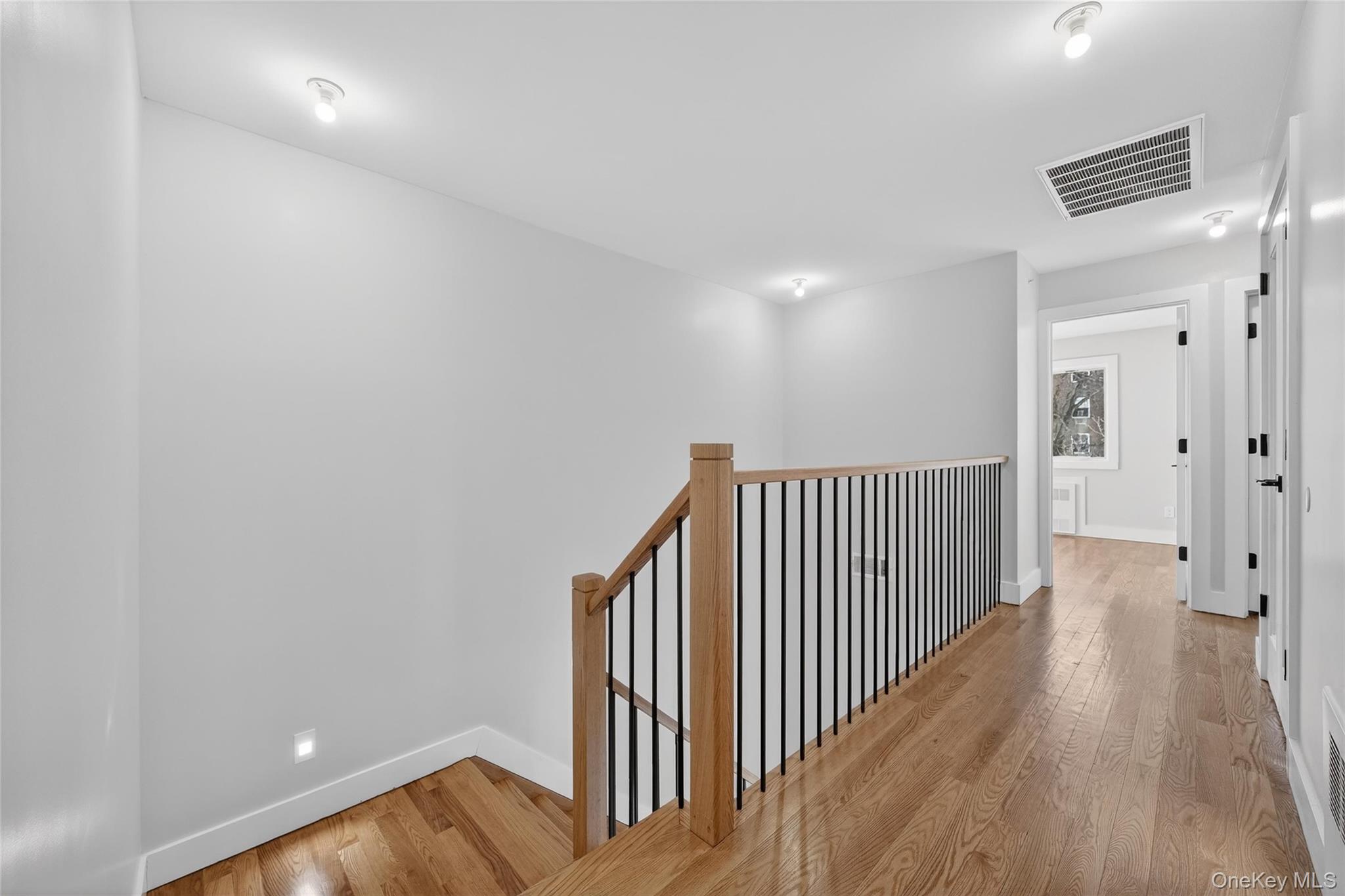 35 South Cole Avenue, Unit 202 Spring Valley, NY 10977 - Photo 23 of 50 a view of a hallway with wooden floor