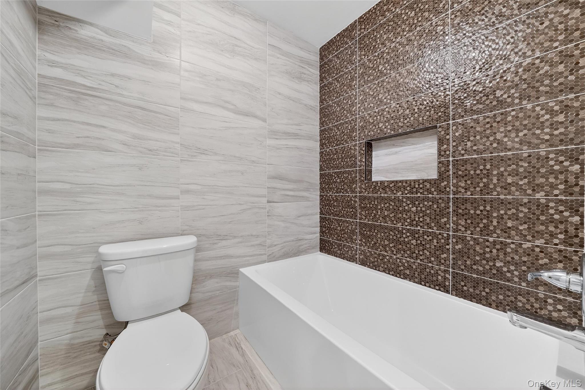 35 South Cole Avenue, Unit 202 Spring Valley, NY 10977 - Photo 44 of 50 a bathroom with a toilet and a sink