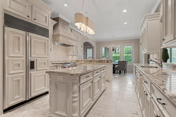 a kitchen with a stove top oven sink and cabinets